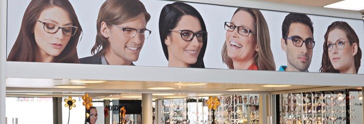Image of a few faces with glasses taken at a Hakim Optical store.